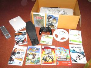 lot 10 image: Wii game system with games...