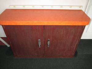 lot 8 image: 4 wide cabinet with Formica top...