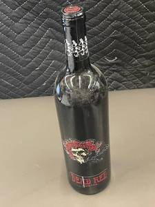 lot 393 image: Grateful Dead Skull and Roses Dead Red Wine Bottle