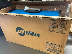 lot 2 image: 1.4 - Miller Dynasty 200 DX Welder with Blue Demon Welding Rods