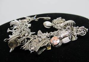 lot 69 image: Wonderful Vintage Sterling Silver Charm Bracelet FULL of Sterling Silver Charms