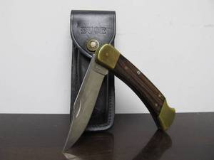 lot 108 image: Vintage BUCK Model 110  Folding Knife wLeather Case