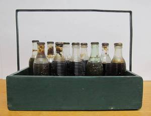 lot 142 image: Interesting Wooden Carrier Full of Old Embossed Soda Bottles
