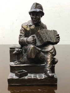 lot 318 image: Vintage Sculpture of a Man Playing the Accordion - Signed Ormond - Made in Ireland