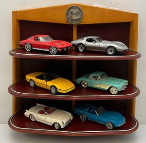 lot 59 image: Vintage Franklin Mint Official History Of The Corvette & Wall Display Shelf