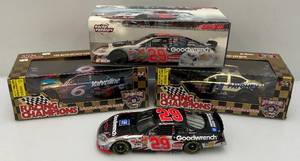 lot 78 image: Misc. Racing Champions 50th Anniversary NASCAR 124 Scale Diecast Cars #6, #11 & Action Brand #29 Kevin Harvick  Victory Burn-out (NIB)