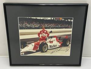 lot 101 image: Al Unser Jr. Signed Photo Framed Behind Glass 12 x 14