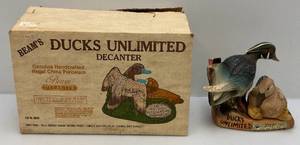 lot 180 image: Vintage Jim Beam Ducks Unlimited  Wood Duck Family Decanter (Empty)