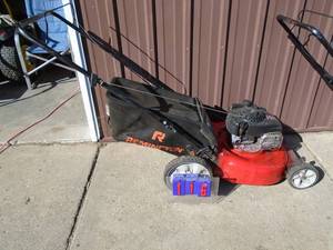 Briggs & Stratton push mower. Runs great. Deck could use replacing with bagger. As shown.