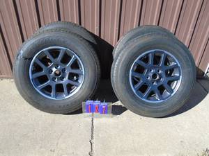 Set of tires. Bridgestone. 25570r18. 5 hole. Jeep wheels. Good tread. Very clean. As shown.