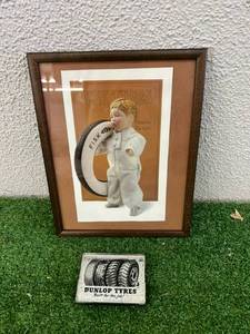 lot 98 image: Framed Fisk Tires Ad & Dunlop Tyres Paperweight