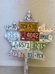 lot 144 image: Maple Leaf Artwork with Canadian License Plates on Plywood 32 x 41