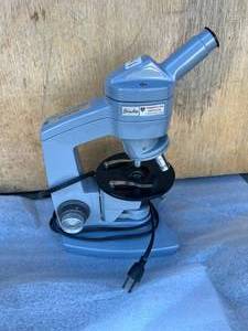 lot 18 image: Sixty American Optical Corporation Microscope