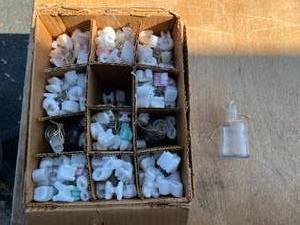 lot 23 image: 12 Mickey Mouse 125 mL TK dropping bottle