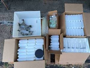 lot 32 image: Pallet Lot- Plastic Bottles, Plastic Snap Bottles, Catheter Tip Syringe 60 mL, Plastic Box with Outlet, Burrette Clamps, Disclaimer Shipping May be expensive, PALLET NOT INLCLUDED