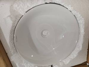 2 round white vessel sinks