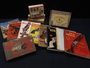 lot 62 image: GUN DIGESTS BOOKS & CIGAR BOXES