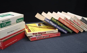 lot 71 image: GUN DIGEST BOOKS AND CIGAR BOXES