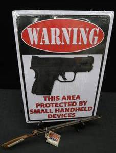 lot 73 image: METAL SIGN AND COLLECTABLE LIGHTER