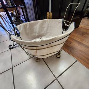 lot 32 image: 2 Rolling Laundry Baskets