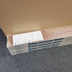 lot 83 image: Simple Solutions, Living Laminate Floors In Russet Oak Four Boxes