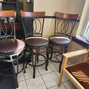 lot 148 image: Three Swivel Barstools Measuring 19 Inches Wide And 46 Inches Tall