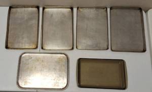 Assortment of Baking Ware - (5) Cookie Sheets (1) Pyrex Pan (2) Cake Pan Lids