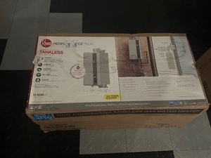 lot 2 image: Unused Like New Rheem Performance Plus 9.5 GPM Smart Non-Condensing Indoor Natural Gas Tankless Water Heater Model ECO200DVELN-3