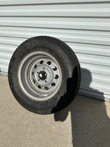lot 112 image: Trailer Wheel  Tire - Holds Air - Good Spare