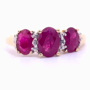 Oval Ruby Three-Stone & Diamond Ring in Yellow Gold