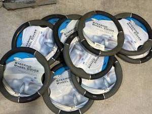 lot 28 image: Lot of 10 New Steering Wheel Covers ($149 retail)