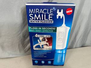 lot 121 image: New Miracle Smile Water Flosser
