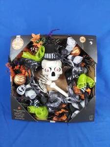 lot 176 image: New Members Mark 26 Pre-Lit 50 Warm White LED, & RGB Eyes Fun Skeleton Wreath