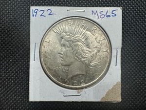 lot 35 image: 1922 Peace Dollar Marked MS 65 when purchased