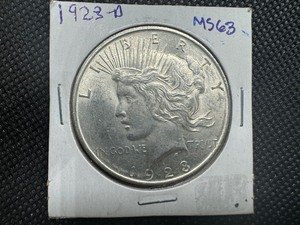 lot 37 image: 1923 D Peace Dollar Marked MS 63 when purchased