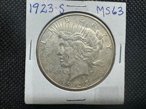 lot 38 image: 1923 S Peace Dollar Marked MS 63 when purchased