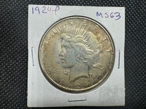lot 39 image: 1924 P Peace Dollar Marked MS 63 when purchased