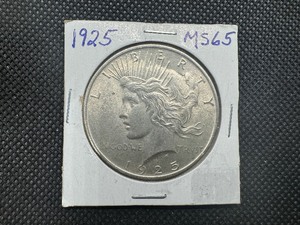 lot 40 image: 1925 Peace Dollar Marked MS 65 when purchased