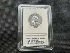 lot 50 image: 2009 Native American Dollar .999 Fine Silver Enriched