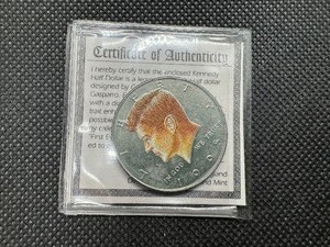 lot 66 image: 1995 Colorized Kennedy Half Dollar with COA