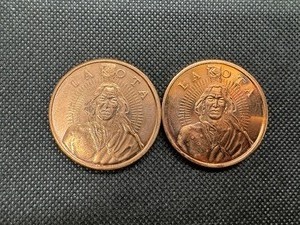 lot 87 image: Two 1 Ounce Copper Rounds with Lakota Design