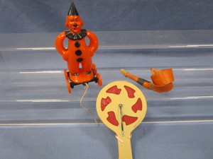 lot 2 image: Vintage Clown Pull Toy, Noisemaker Paddle, Blow Out
