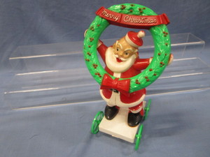 lot 15 image: Vintage Santa with Wreath Pull Toy