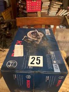 lot 25 image: Bosch 7- 14 inch Circular Saw - New in Box
