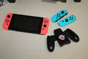 lot 118 image: Nintendo Switch with Pupper Controller Attachment
