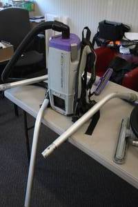 lot 10 image: ProTeam Super Coach Pro 6 Backpack Vacuum with Hose and Handles