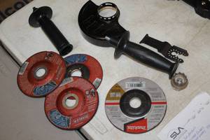 lot 67 image: (2) Tool Handles, (1) Grinder Guard and (4) 4-12 Cut-Off Wheels