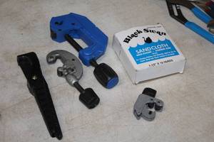 lot 61 image: (3) Pipe Cutters, (1) Hose Cutter and (1) Box of Black Swan Sand Cloth Water Resistant Aluminum Oxide 120 Grit 1-12x10 yards
