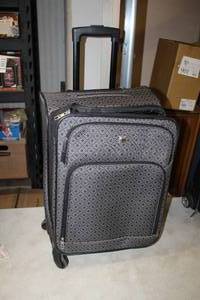 lot 258 image: Yusuf Mohamm Rolling Luggage