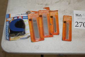 lot 270 image: Lot of (5) Office Supplies - Fiskars 5-pack Snap-off Utility Blades (x4) and Portable Power Sharpener (x1)